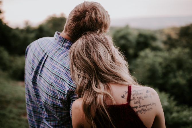 couple standing on mountain, dating