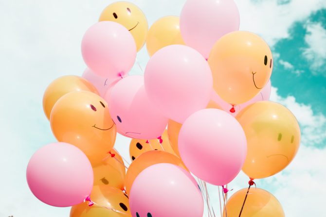 low-angle photo of pink and orange balloons, crowdfunding