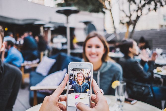 person taking photo of woman, personal branding