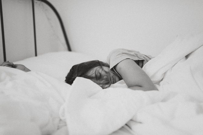 black and white image of woman sleeping