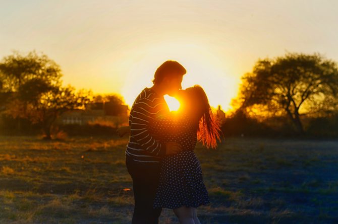 kissing during sunset