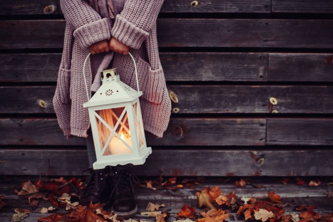 woman holding lamp autumn