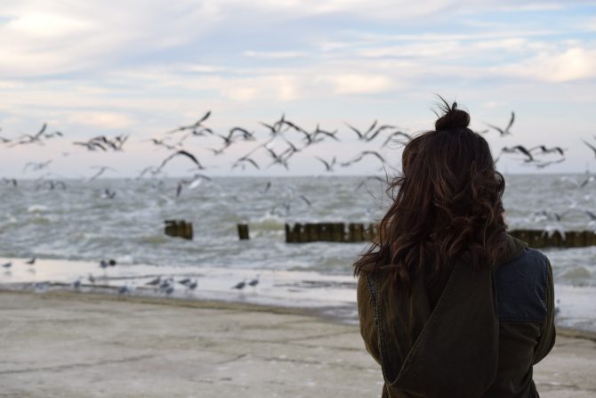 dealing with depression, woman standing on beach